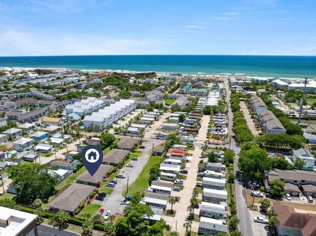 an aerial view of city and ocean