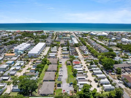 an aerial view of residential building and lake