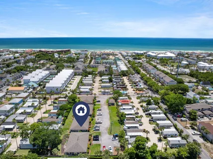 an aerial view of residential building and lake
