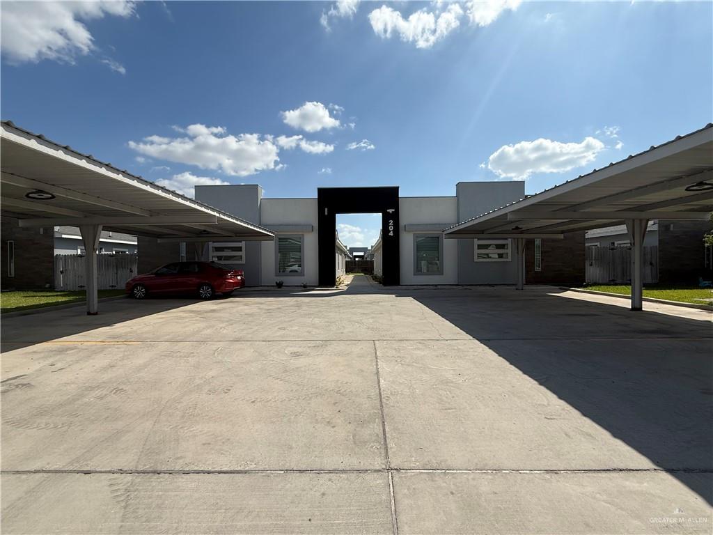 a view of a building with a yard