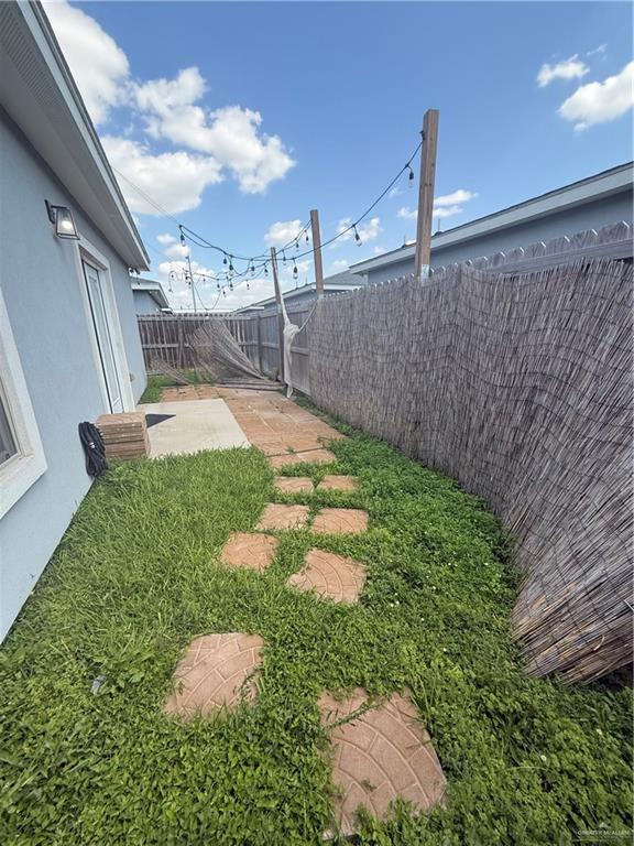 204 West Rutherford Avenue, Unit 4 Edinburg, TX 78541 - Photo 12 of 12 a view of a garden with a pathway