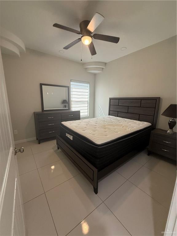 204 West Rutherford Avenue, Unit 4 Edinburg, TX 78541 - Photo 8 of 12 a bedroom with a bed and window