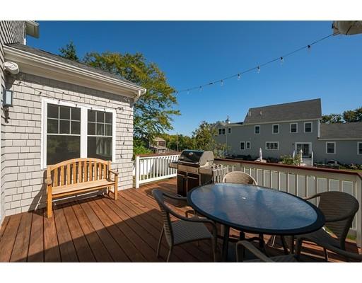 48 Marion Road Scituate, MA 02066 - Photo 13 of 33 a view of a balcony with a table and chairs