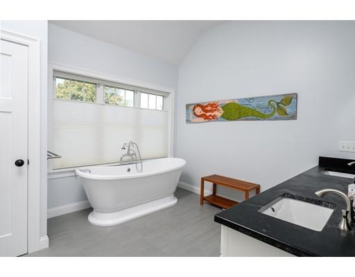 48 Marion Road Scituate, MA 02066 - Photo 23 of 33 a living room with a couch and a window