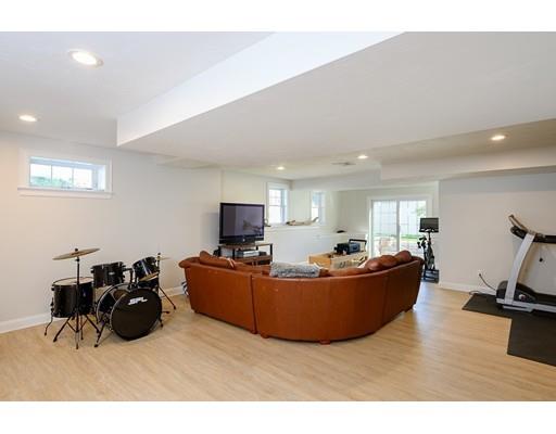 48 Marion Road Scituate, MA 02066 - Photo 28 of 33 a living room with furniture and a flat screen tv