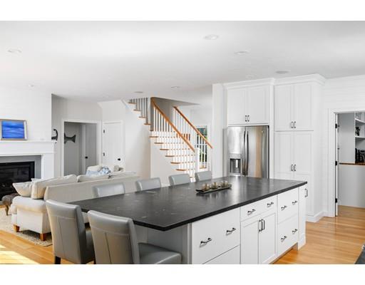 48 Marion Road Scituate, MA 02066 - Photo 4 of 33 a kitchen with granite countertop a sink cabinets and stainless steel appliances