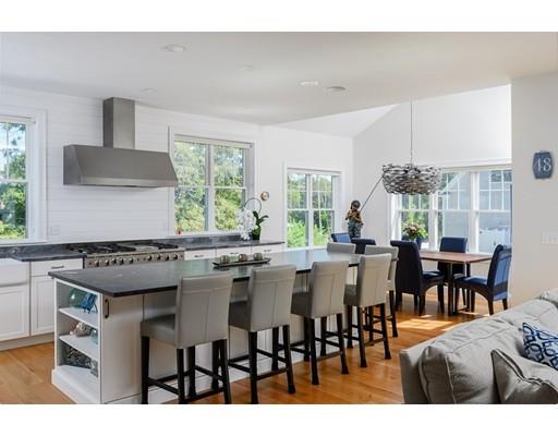 48 Marion Road Scituate, MA 02066 - Photo 8 of 33 a kitchen with a table and chairs in it