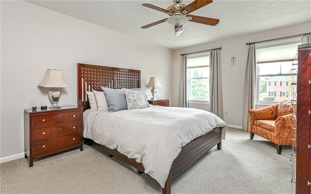123 Weybridge Road Gibsonia, PA 15044 - Photo 15 of 25 a bedroom with a bed and a chandelier