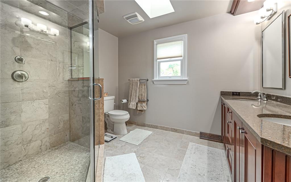 123 Weybridge Road Gibsonia, PA 15044 - Photo 16 of 25 a bathroom with a sink a toilet and shower