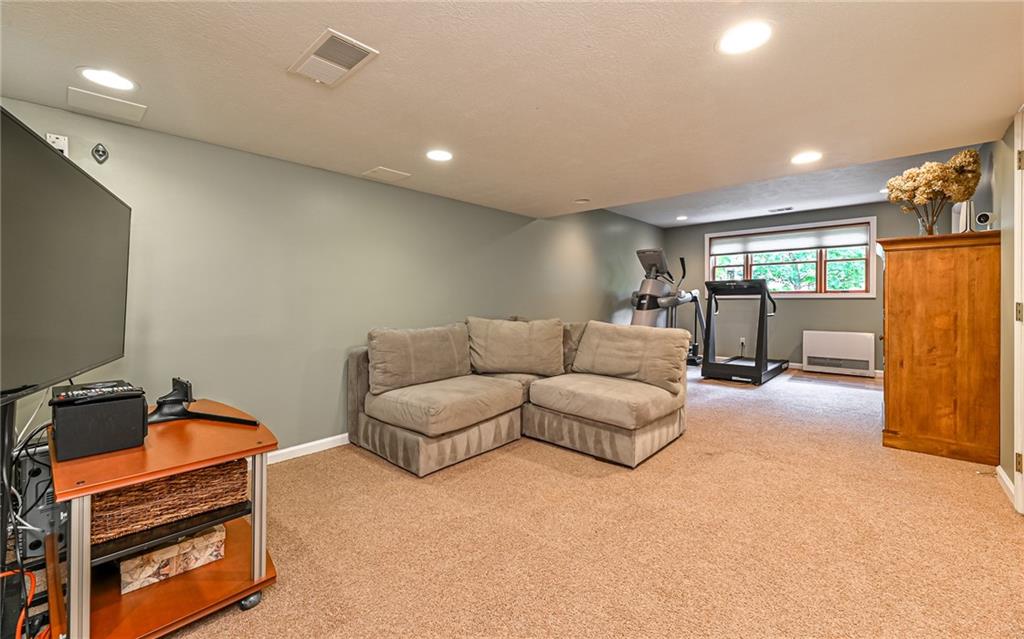 123 Weybridge Road Gibsonia, PA 15044 - Photo 17 of 25 a living room with furniture and a flat screen tv