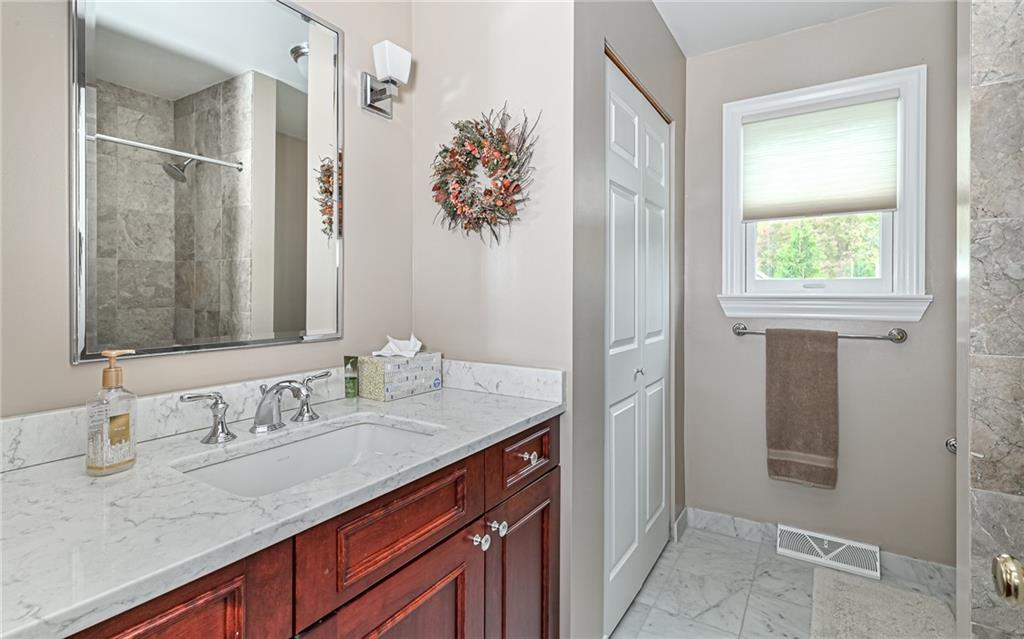 123 Weybridge Road Gibsonia, PA 15044 - Photo 18 of 25 a bathroom with a granite countertop sink and a mirror