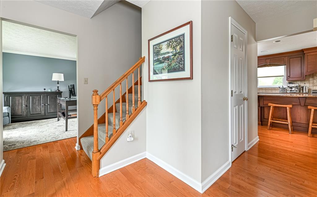 123 Weybridge Road Gibsonia, PA 15044 - Photo 2 of 25 a view of a livingroom with wooden floor and staircase