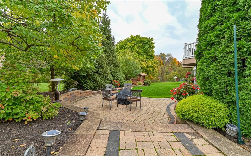 123 Weybridge Road Gibsonia, PA 15044 - Photo 22 of 25 a view of a table and chairs in backyard with plants