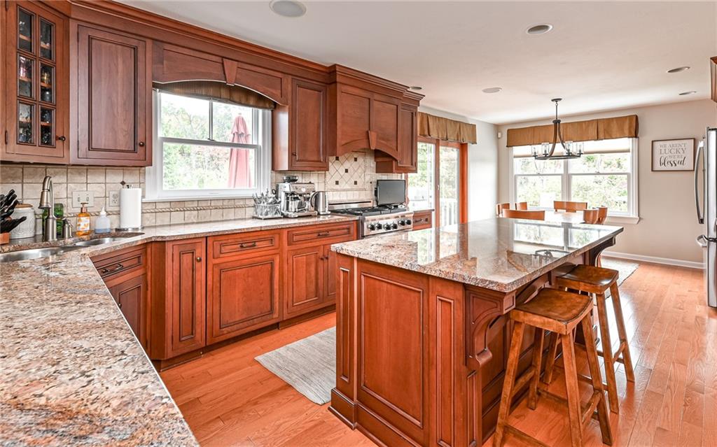 123 Weybridge Road Gibsonia, PA 15044 - Photo 4 of 25 a kitchen with stainless steel appliances granite countertop a sink window and cabinets