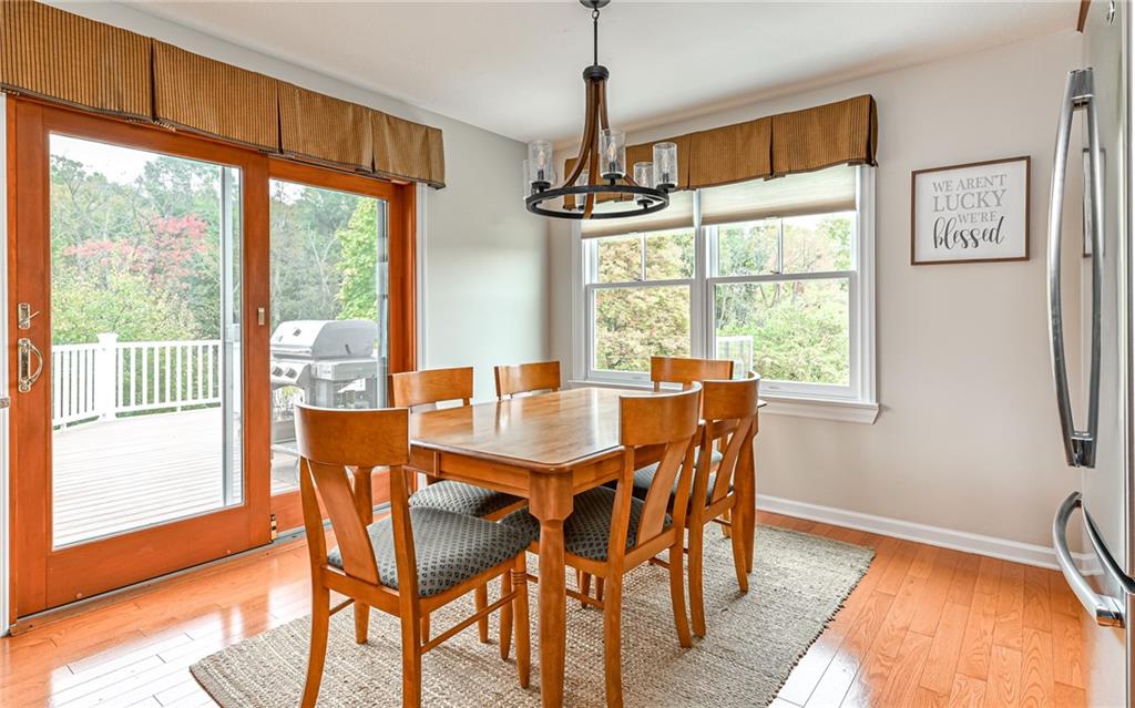 123 Weybridge Road Gibsonia, PA 15044 - Photo 7 of 25 a view of a dining room with furniture window and wooden floor