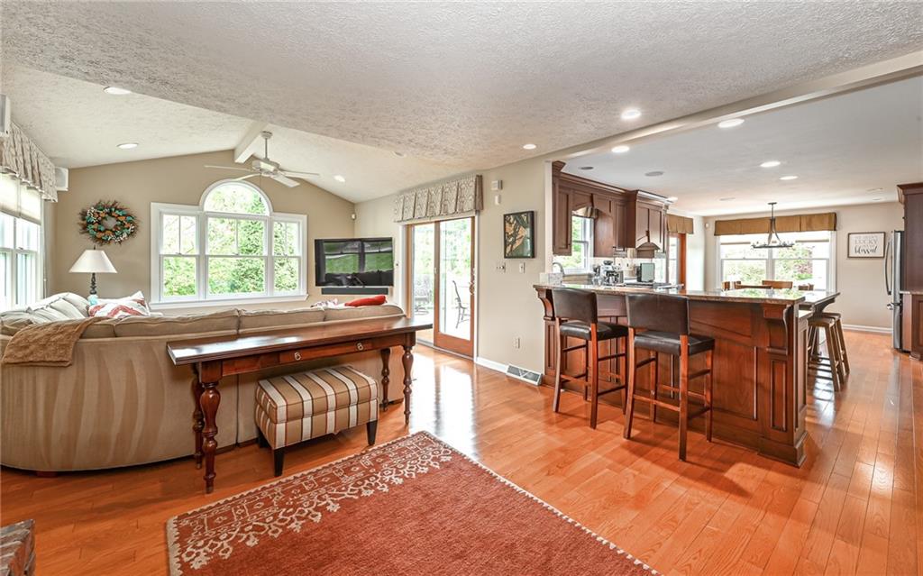 123 Weybridge Road Gibsonia, PA 15044 - Photo 9 of 25 a living room with stainless steel appliances granite countertop furniture wooden floor and a view of kitchen