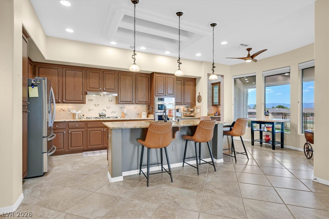 1823 Baton Rouge Street Henderson, NV 89052 - Photo 13 of 60 Gourmet design highlights this spacious kitchen complete with a large central island and tile flooring.