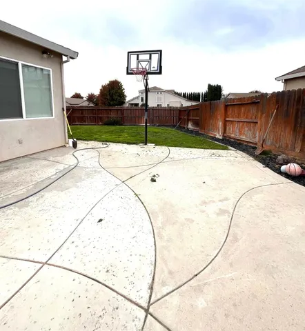 a view of a swimming pool with a yard