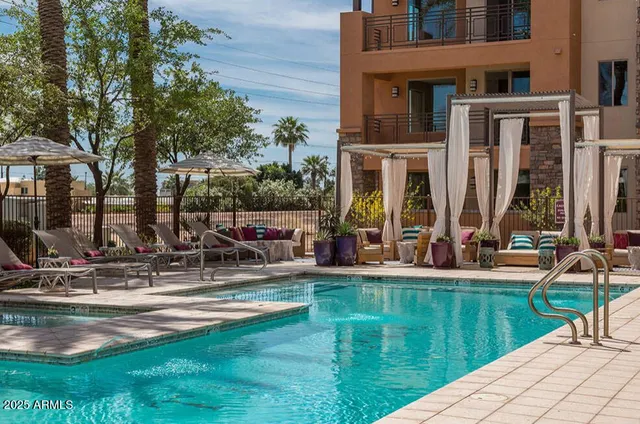 a view of a house with backyard porch and sitting area
