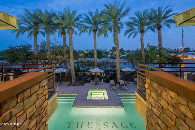 a view of swimming pool with outdoor seating