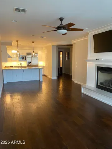 a view of a living room with a fireplace