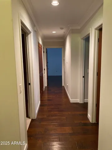 a view of hallway with wooden floor