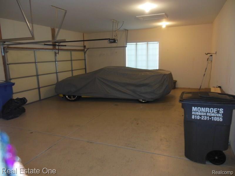 3225 Outback Trail Pinckney, MI 48169 - Photo 39 of 76 3+ CAR GARAGE HAS A WORK AREA TOO!