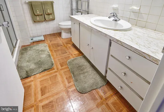 a bathroom with a sink and mirror