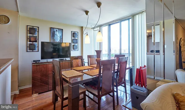 a dining room with furniture and window