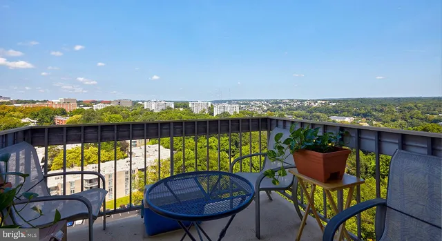 a view of a chairs and table in patio
