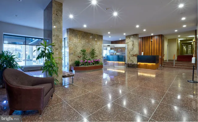 a lobby with entryway and flowers