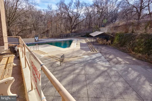 a front view of a building with parking space