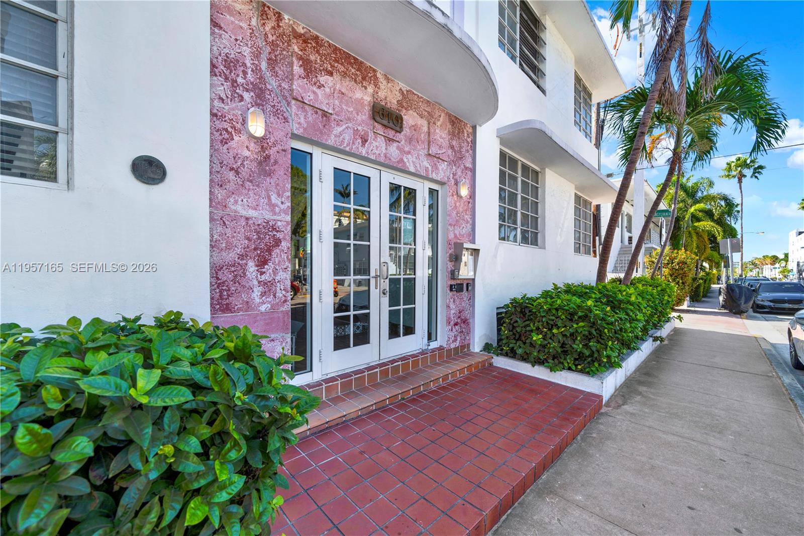 610 8th Street, Unit 102R Miami Beach, FL 33139 - Photo 1 of 22 front view of a brick house with a yard