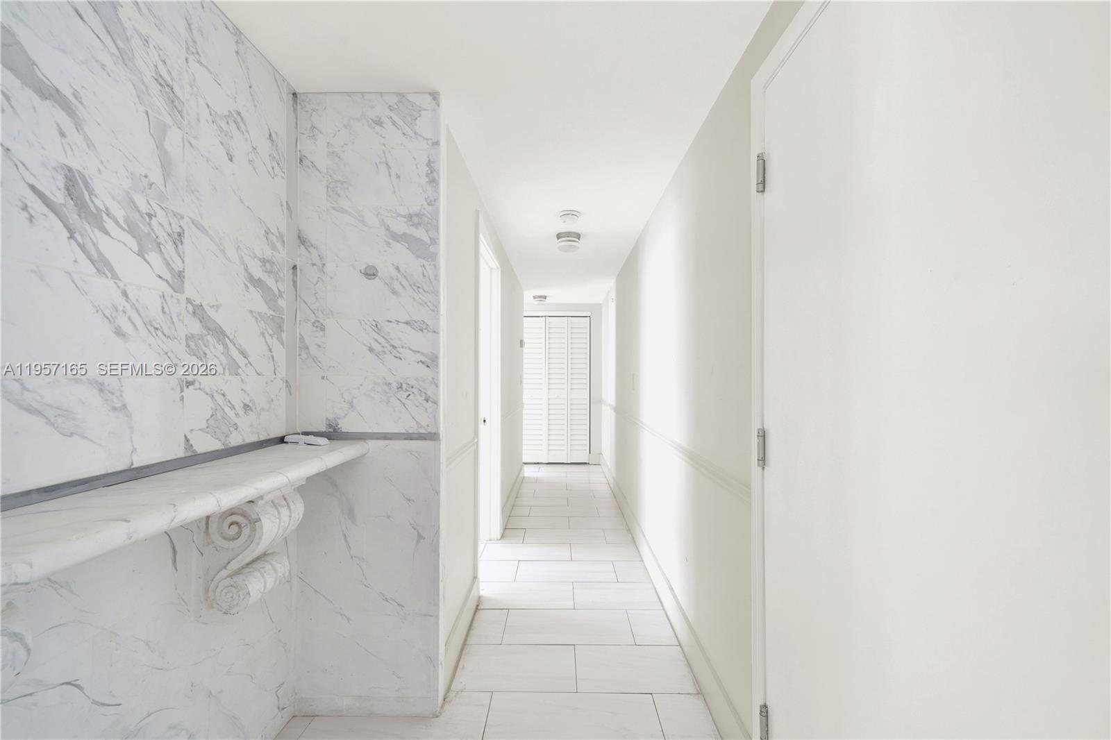 610 8th Street, Unit 102R Miami Beach, FL 33139 - Photo 18 of 22 a bathroom with a bathtub and shower