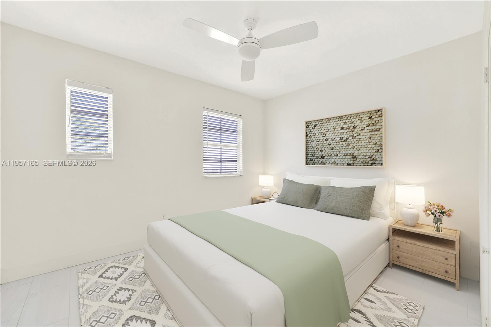 610 8th Street, Unit 102R Miami Beach, FL 33139 - Photo 20 of 22 a bedroom with a large bed and a window