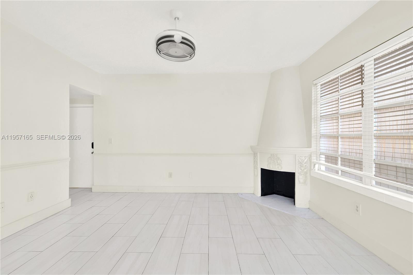 610 8th Street, Unit 102R Miami Beach, FL 33139 - Photo 6 of 22 an empty room with windows