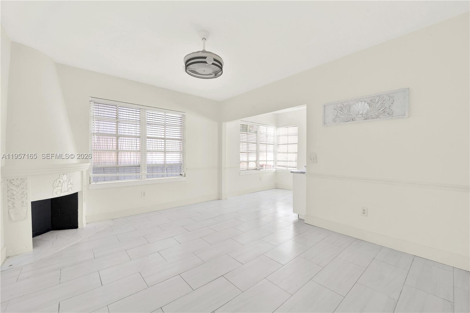 610 8th Street, Unit 102R Miami Beach, FL 33139 - Photo 8 of 22 an empty room with windows