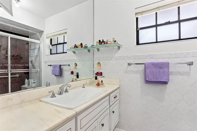 a bedroom with a bed and a television