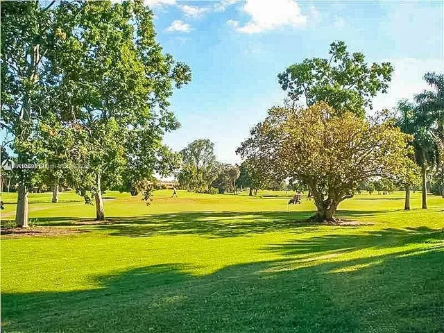 a living room with furniture window and wooden floor