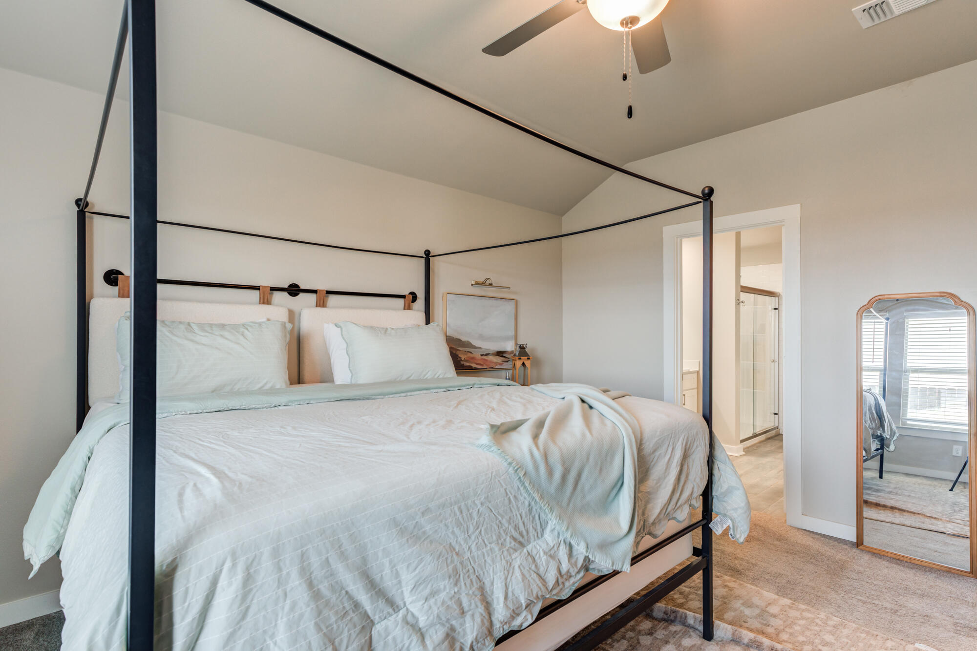 4613 126th Street Lubbock, TX 79424 - Photo 24 of 37 a bedroom with a bed and a chandelier