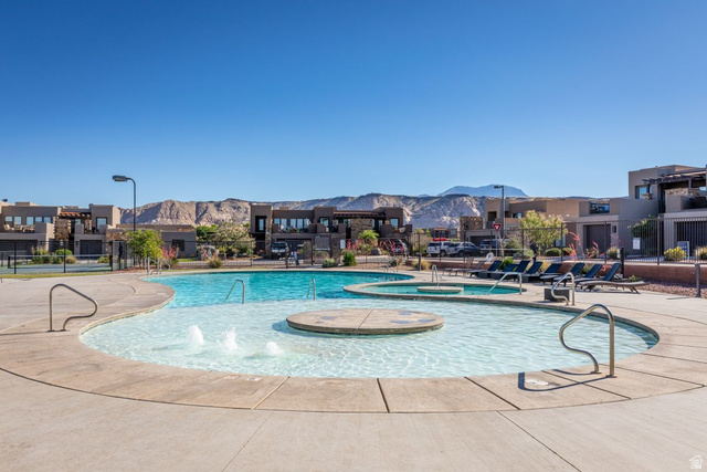 4845 Fishers Is Way St. George, UT 84770 - Photo 38 of 41 Community pool with a mountain view, a patio area, a hot tub, and a residential view