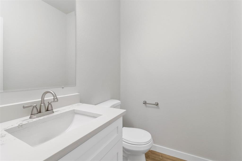 312 East Shepherd Street, Unit 312 Denison, TX 75021 - Photo 13 of 15 a bathroom with a sink and a toilet