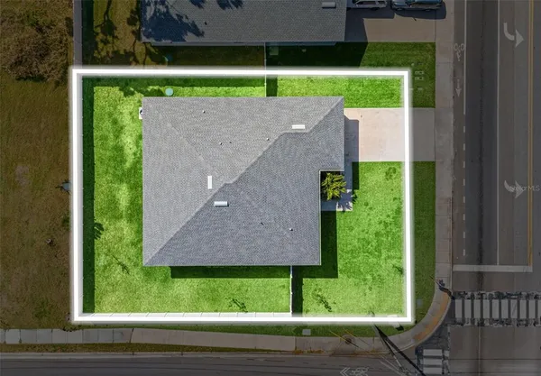 a view of a pool with lawn chairs