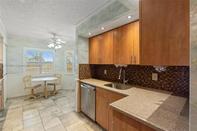a view of a dining room with furniture wooden floor and chandelier