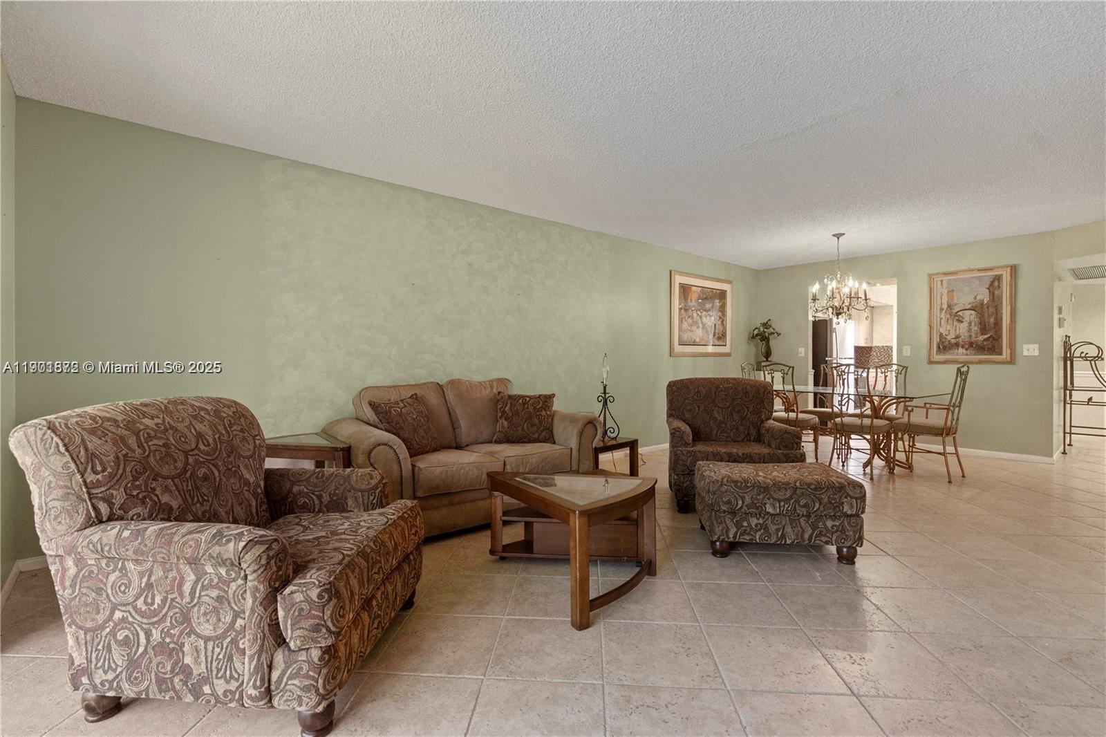 1603 Abaco Drive, Unit K4 Coconut Creek, FL 33066 - Photo 17 of 36 a living room with furniture and a couch