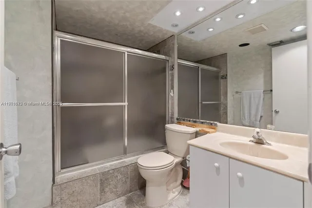 a bathroom with a toilet and a sink