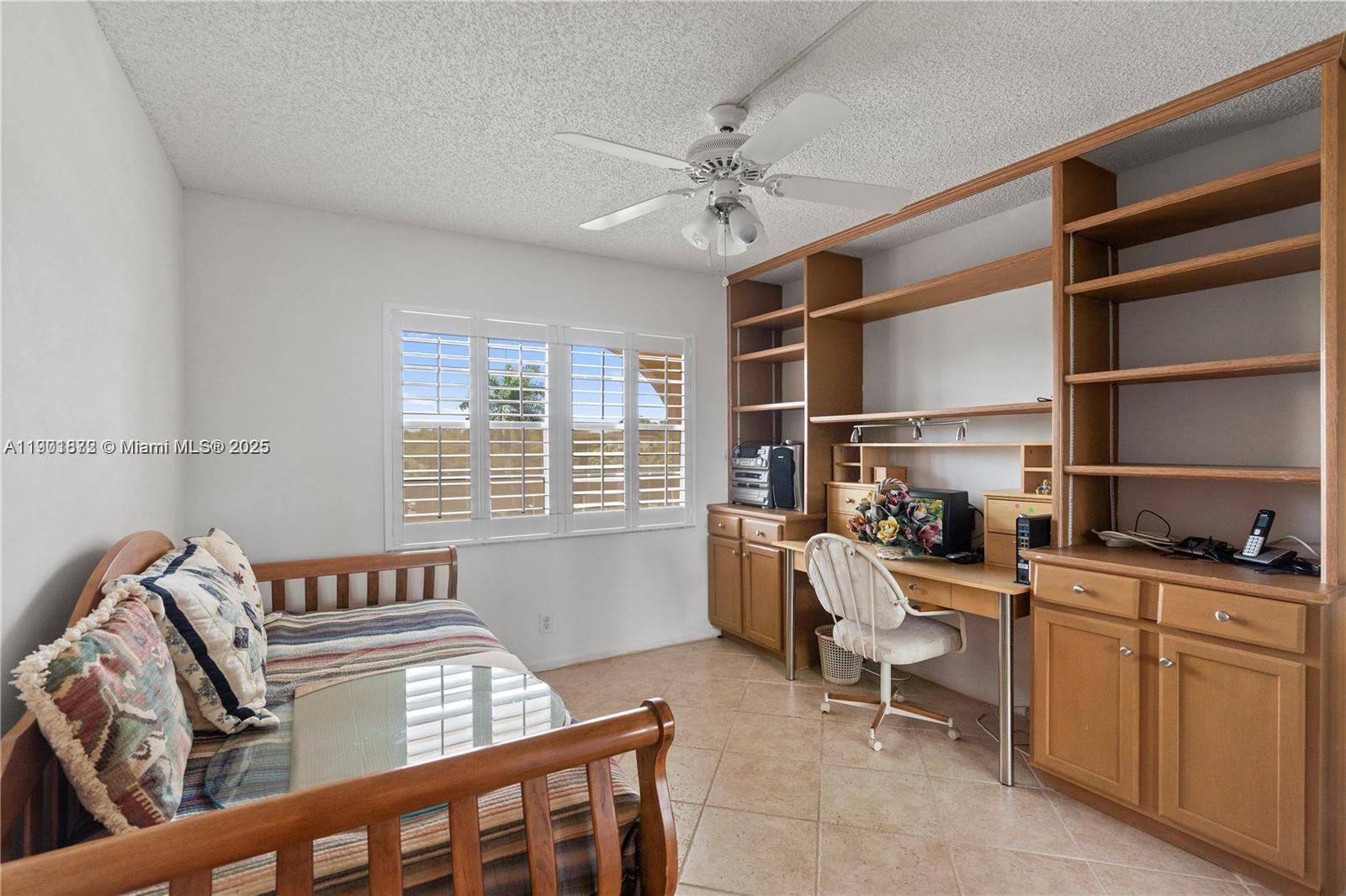 1603 Abaco Drive, Unit K4 Coconut Creek, FL 33066 - Photo 22 of 36 a bedroom with furniture and a window