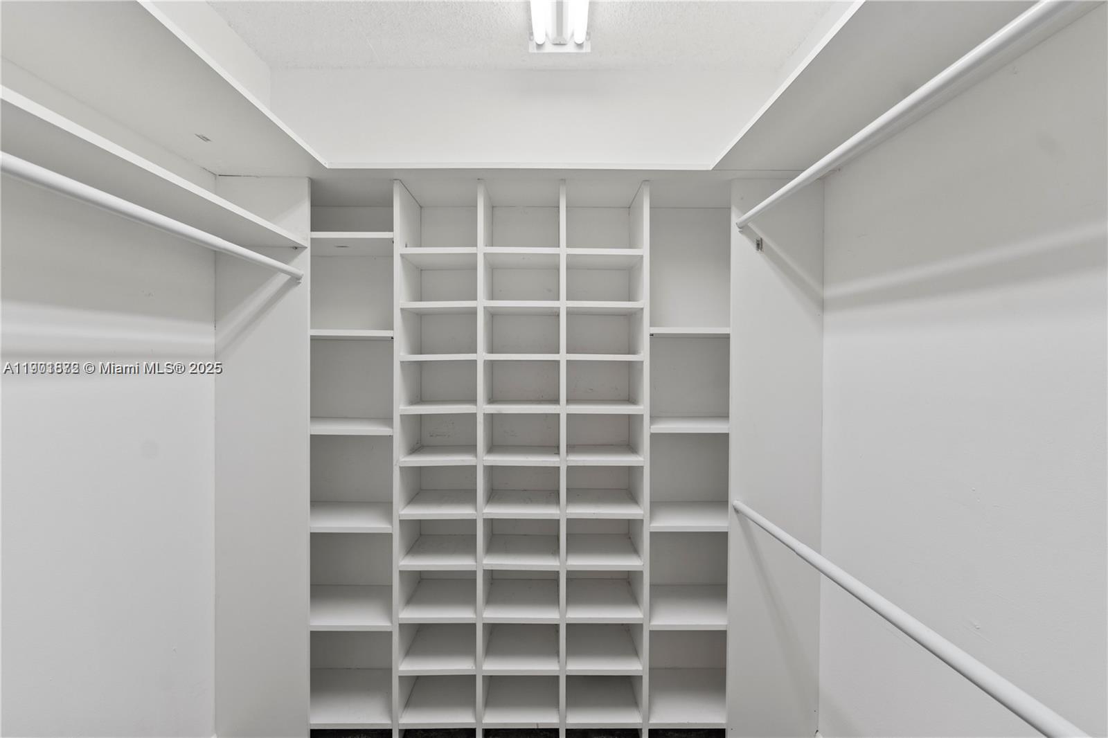 1603 Abaco Drive, Unit K4 Coconut Creek, FL 33066 - Photo 25 of 36 a view of an empty walk in closet