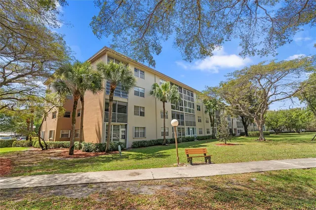 a view of a park with large trees