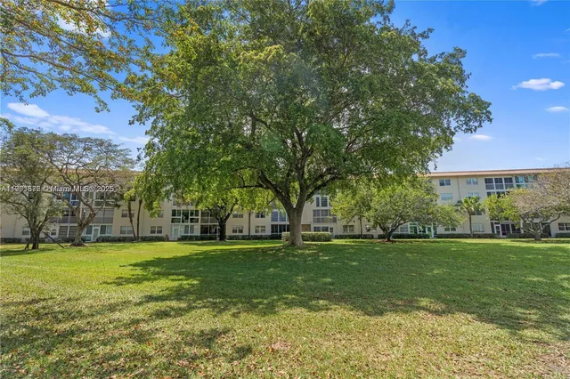 a view of a house with snow on the background